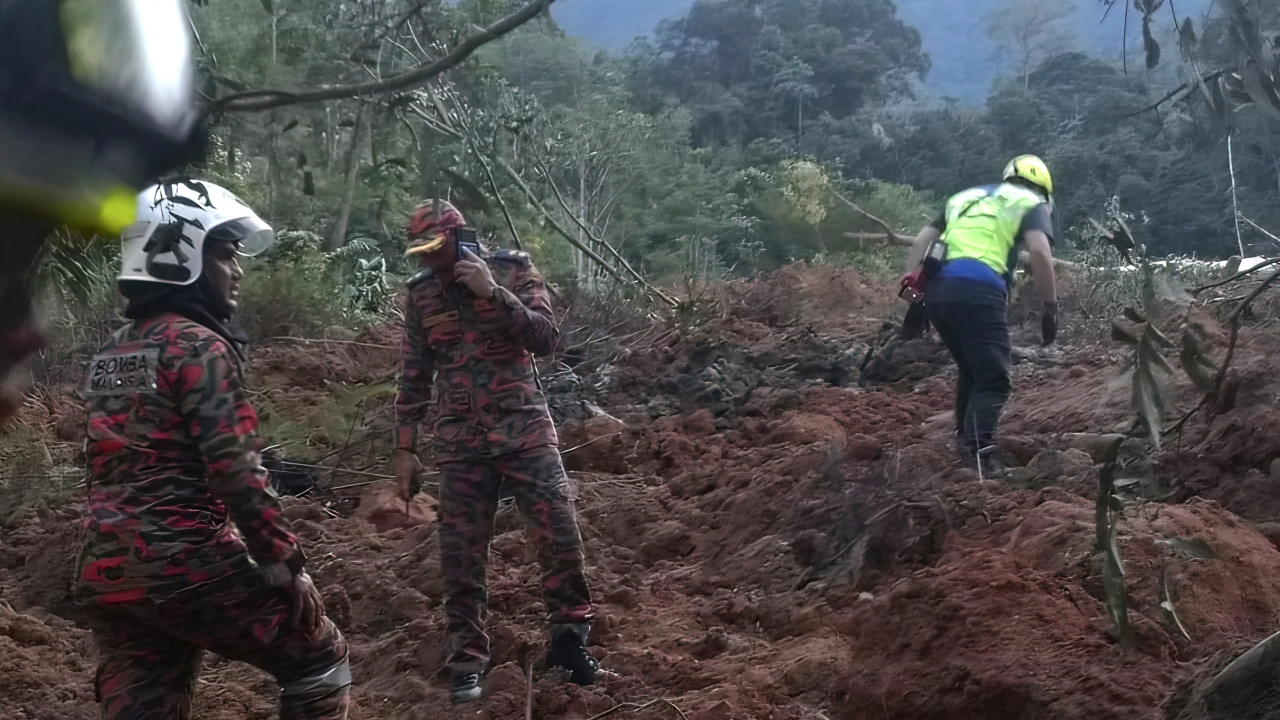 Rescuers work during a rescue and evacuation operation following a landslide