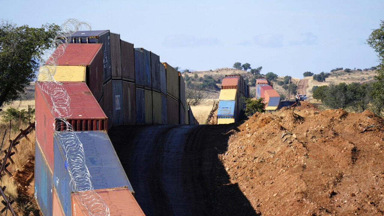 Double-stacked shipping containers in San Rafael Valley, Arizona, provide a wall between the United States and Mexico.