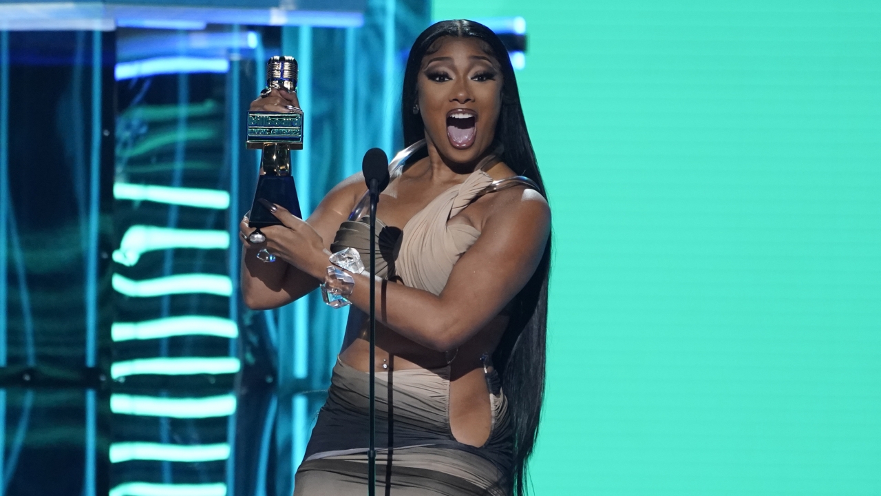 Megan Thee Stallion accepts the award for top rap female artist at the Billboard Music Awards