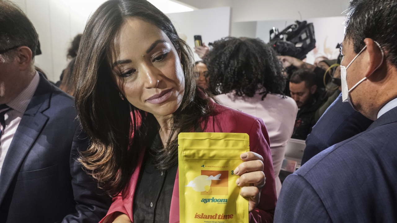 New York City Council Member Carlina Rivera bags her purchase of cannabis gummies at Housing Works