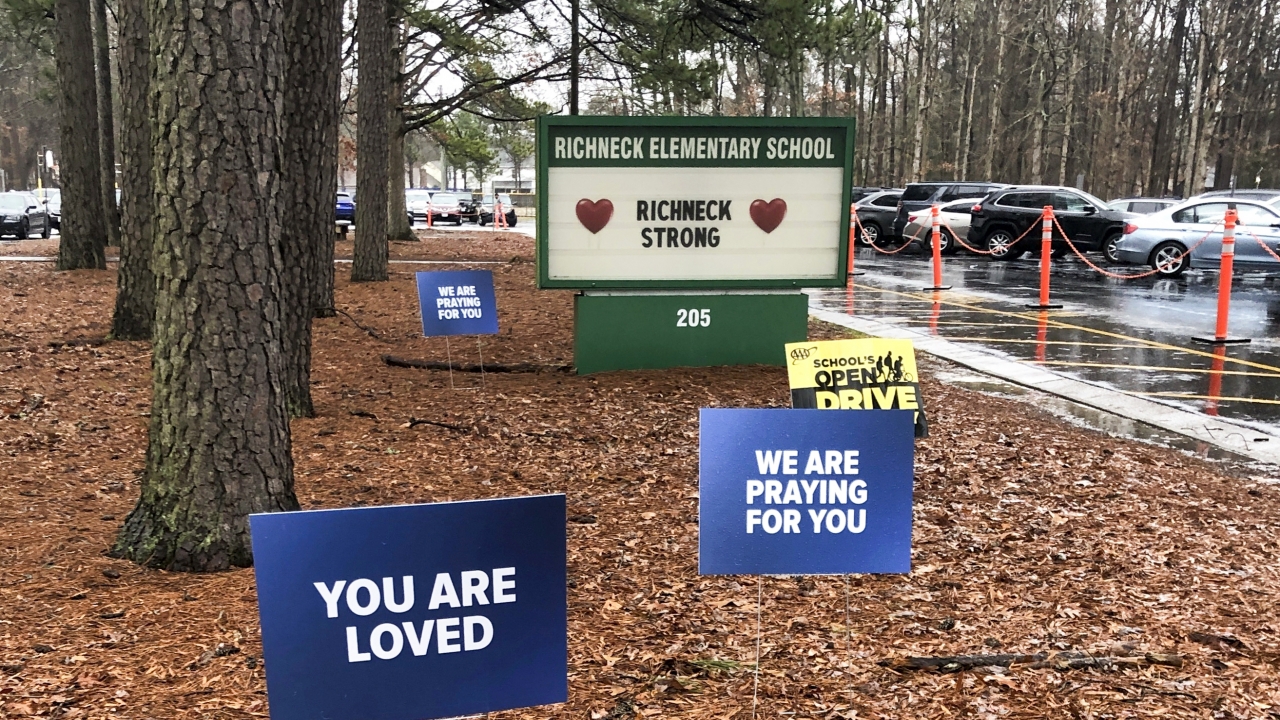 Signs outside Richneck Elementary School, where a 6-year-old shot his teacher.