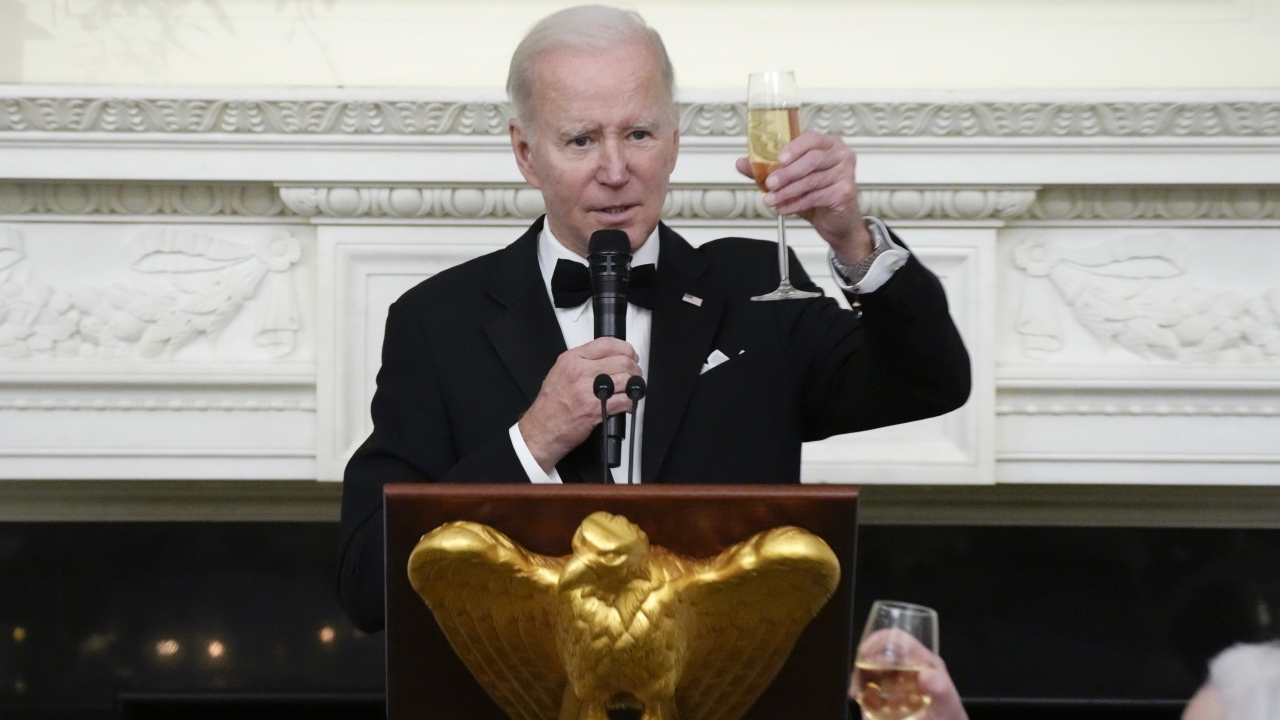 President Joe Biden toasts during a dinner reception for governors and their spouses.