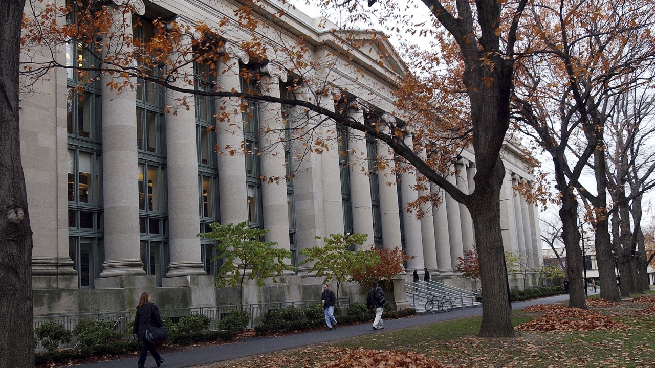 Students walk through the Harvard Law School area on campus.