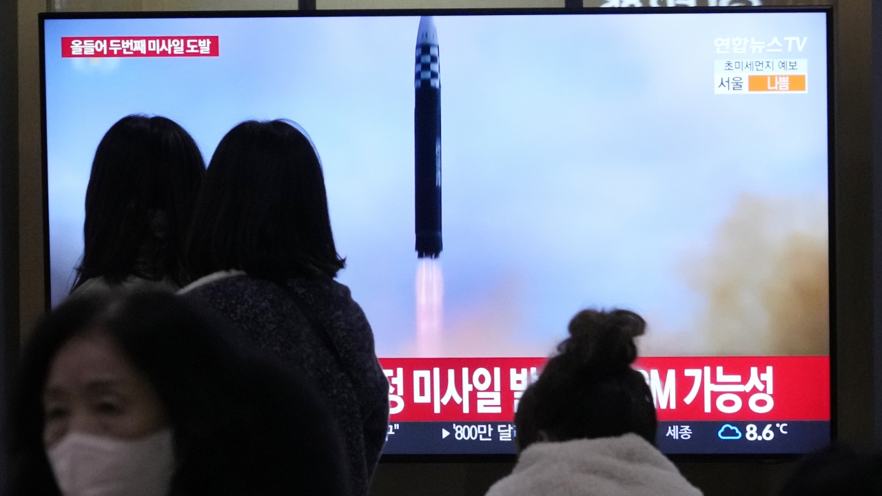 A TV shows North Korea's missile launch during a news program.