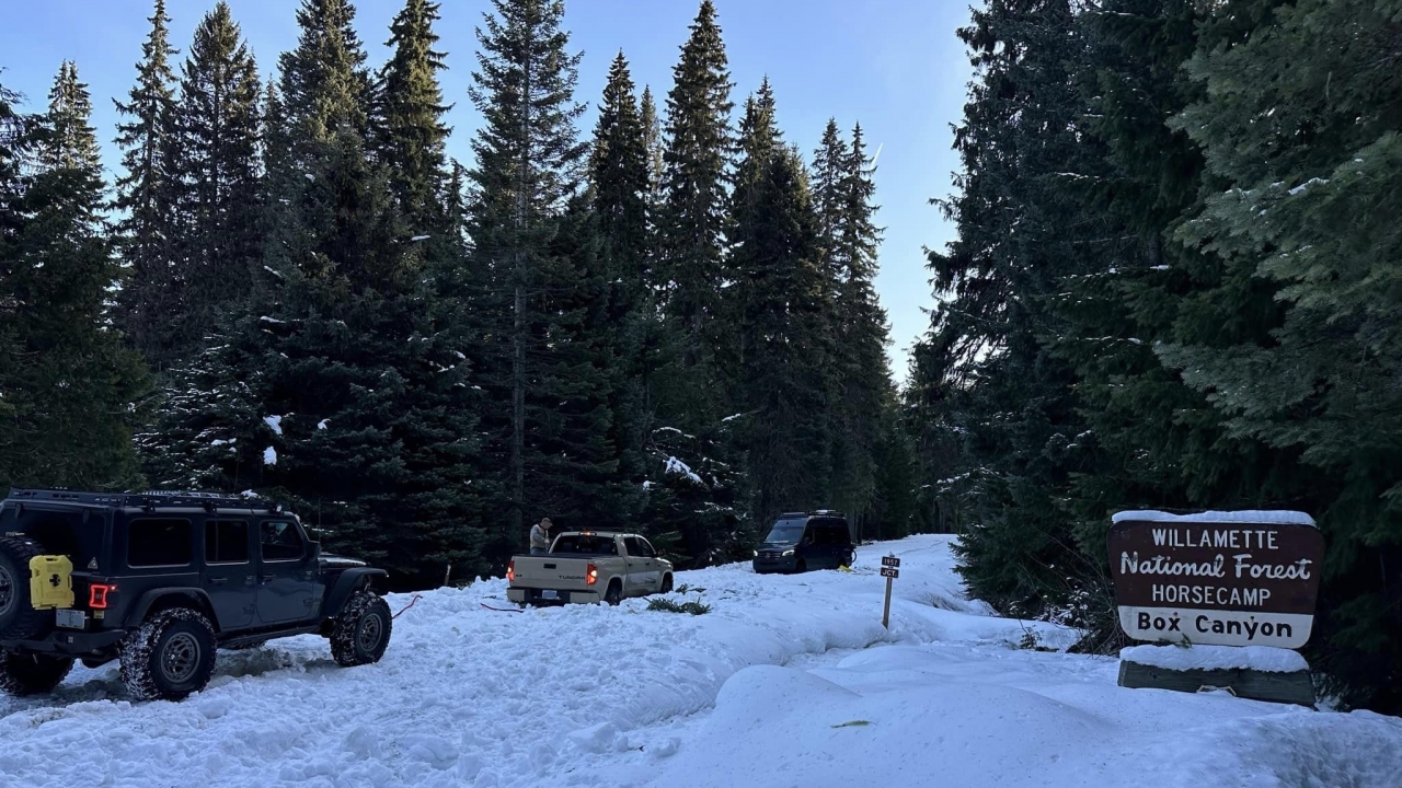 Rescue crews help a motorist stuck in the snow at Willamette National Forest in Oregon.