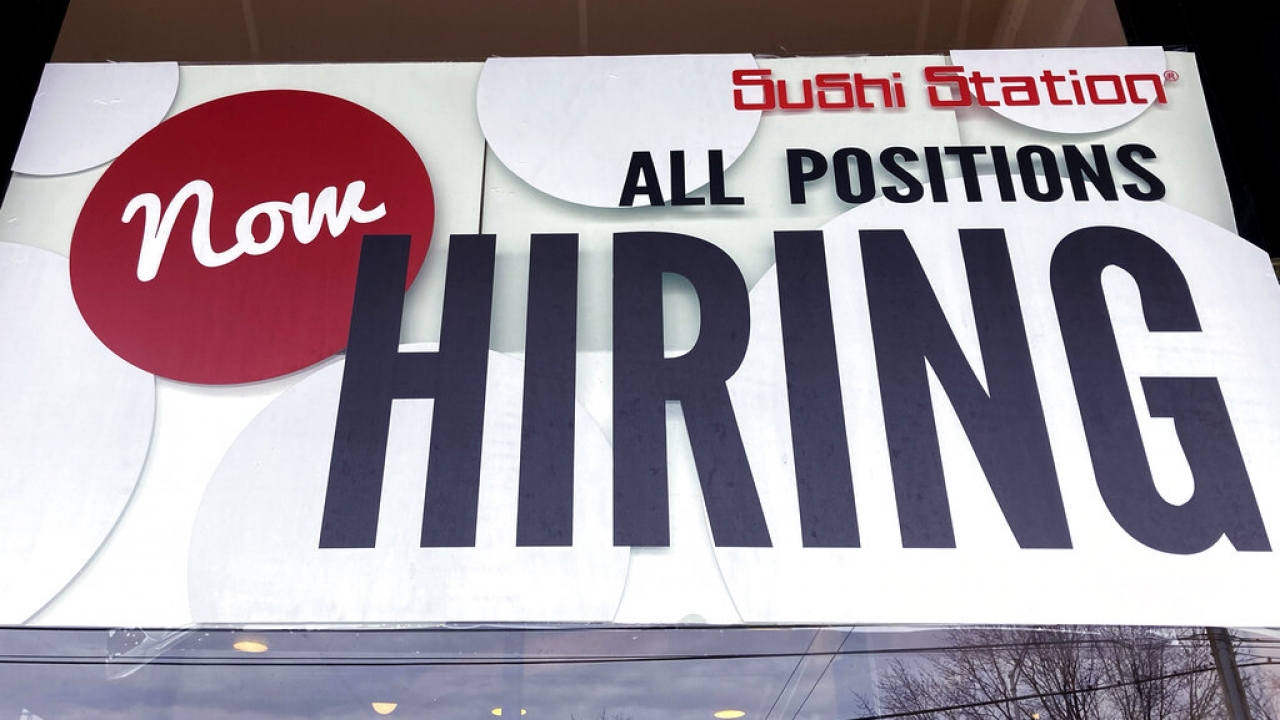 Now hiring sign.