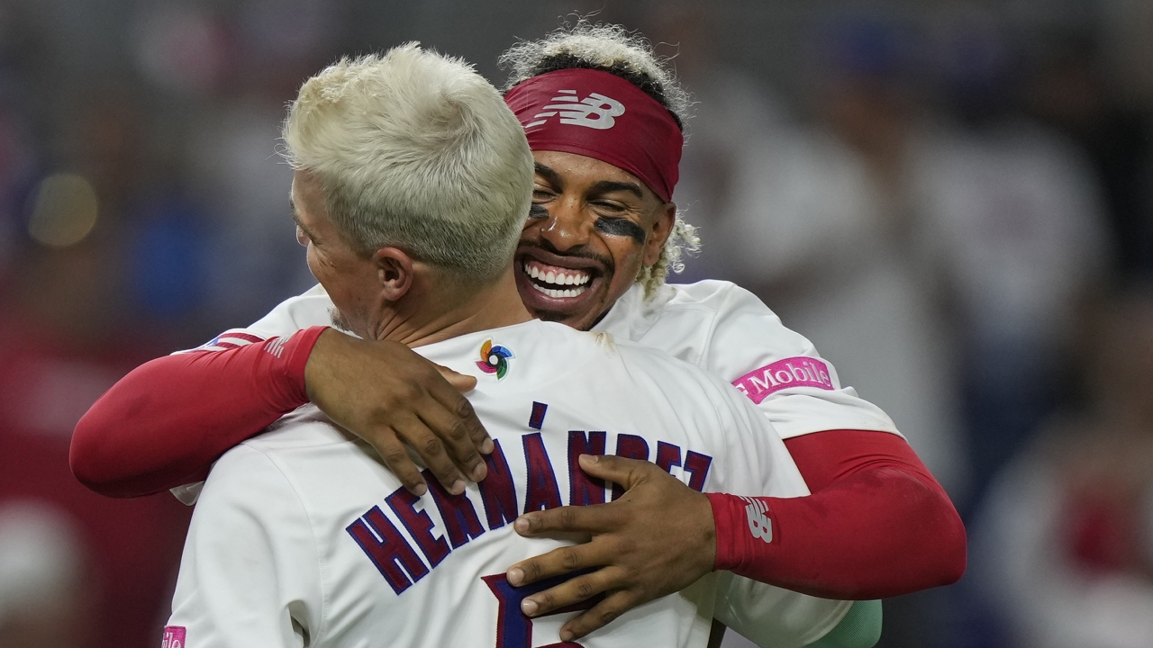 Puerto Rico's Francisco Lindor, rear, hugs teammate Enrique Hernandez after a World Baseball Classic win over Israel.
