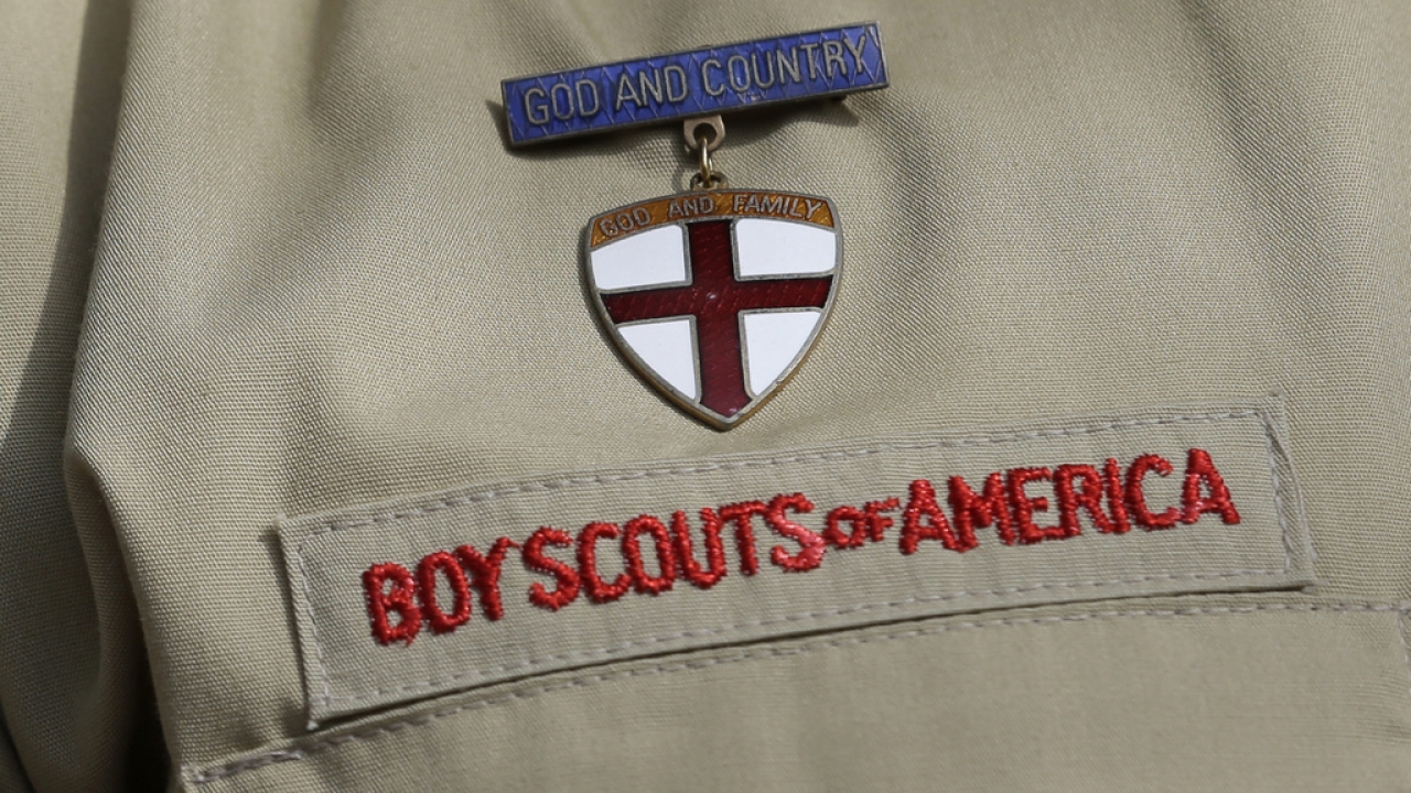 A close up of a boy Scout uniform.