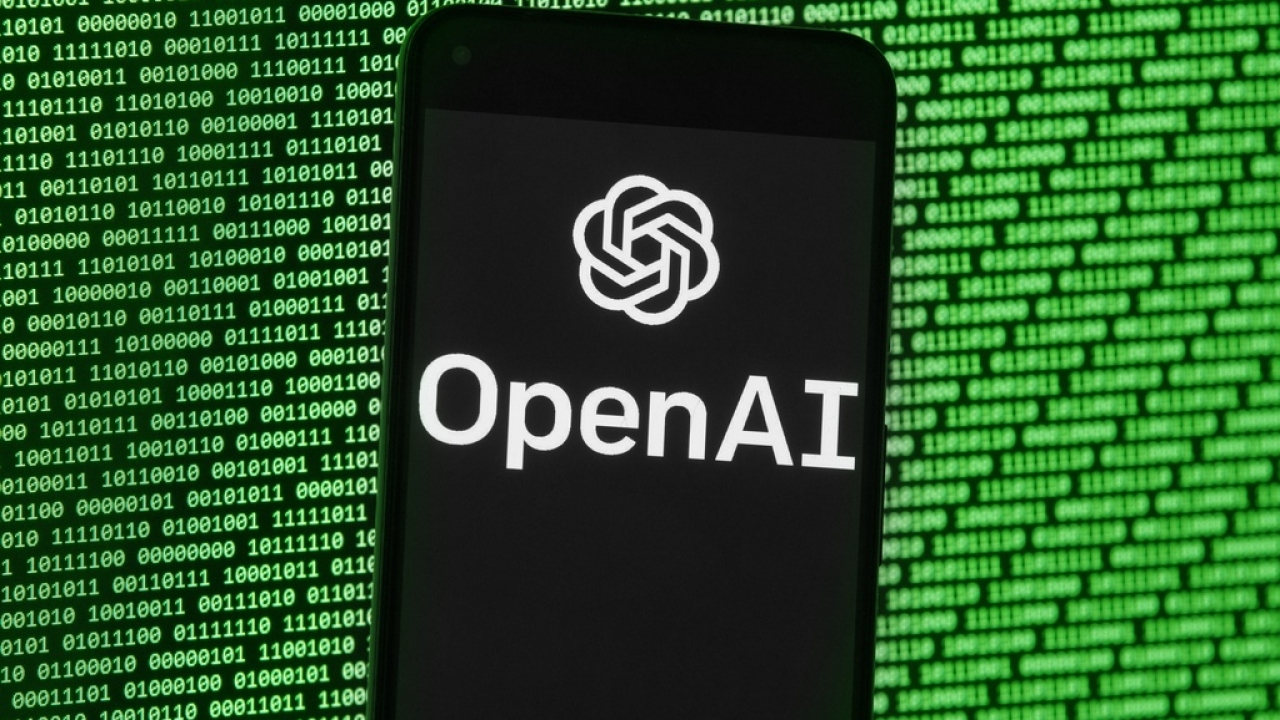 The OpenAI logo appears on a mobile phone.