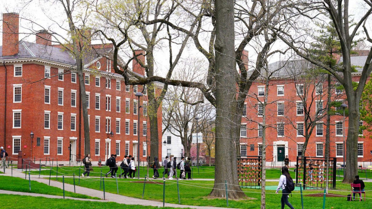 Students walk through Harvard Yard on the campus of Harvard University.