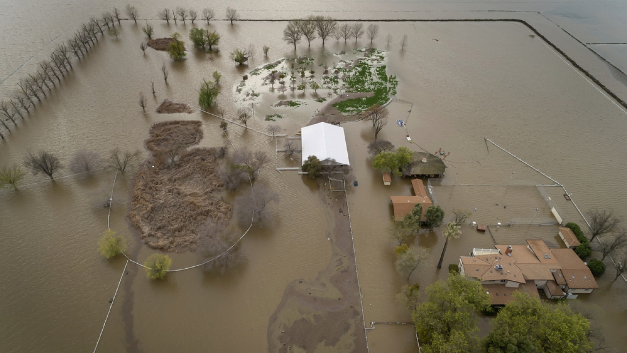 A home sits in rising floodwaters after a levee break caused extensive flooding around Corcoran, Calif.