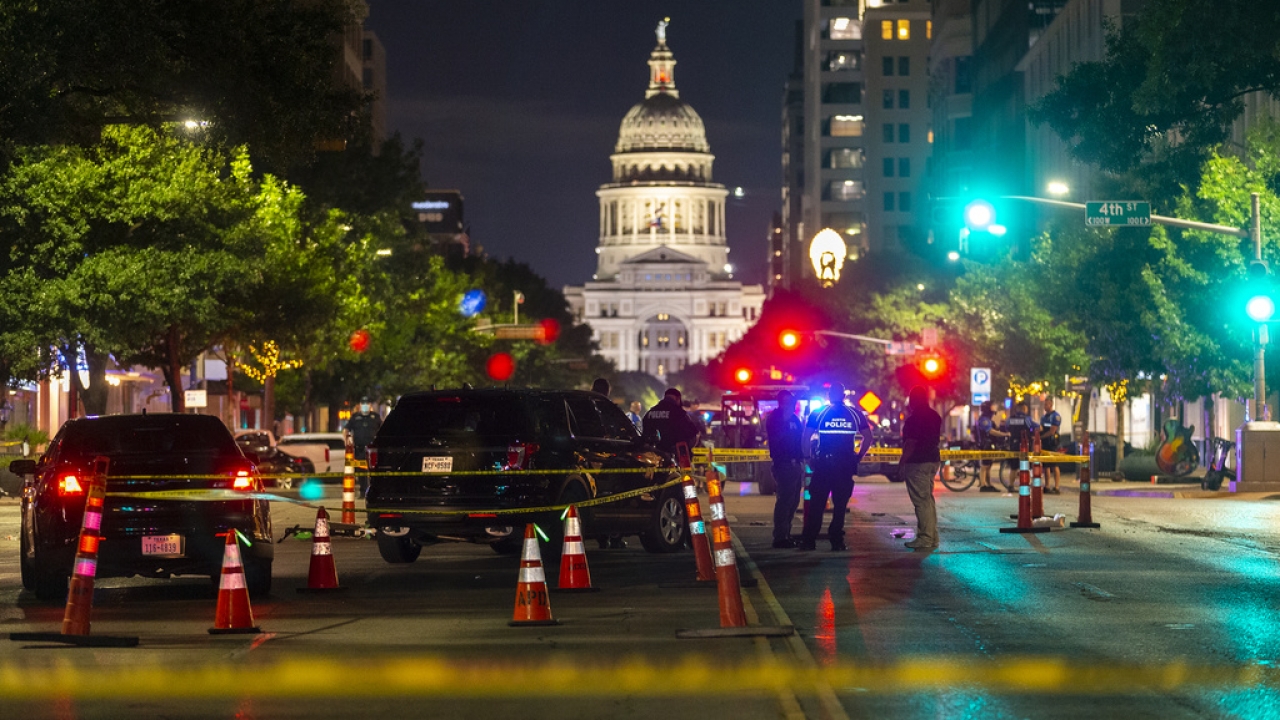 Police investigate a homicide shooting that occurred at a demonstration against police violence in downtown Austin, TX.