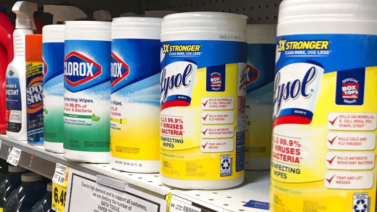 Containers of Lysol and Clorox wipes are on sale at a grocery store.