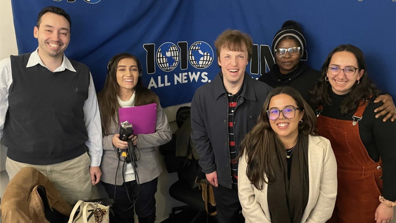 Journalism professor Nick Hirshon, left, with students at 1010 WINS Radio.