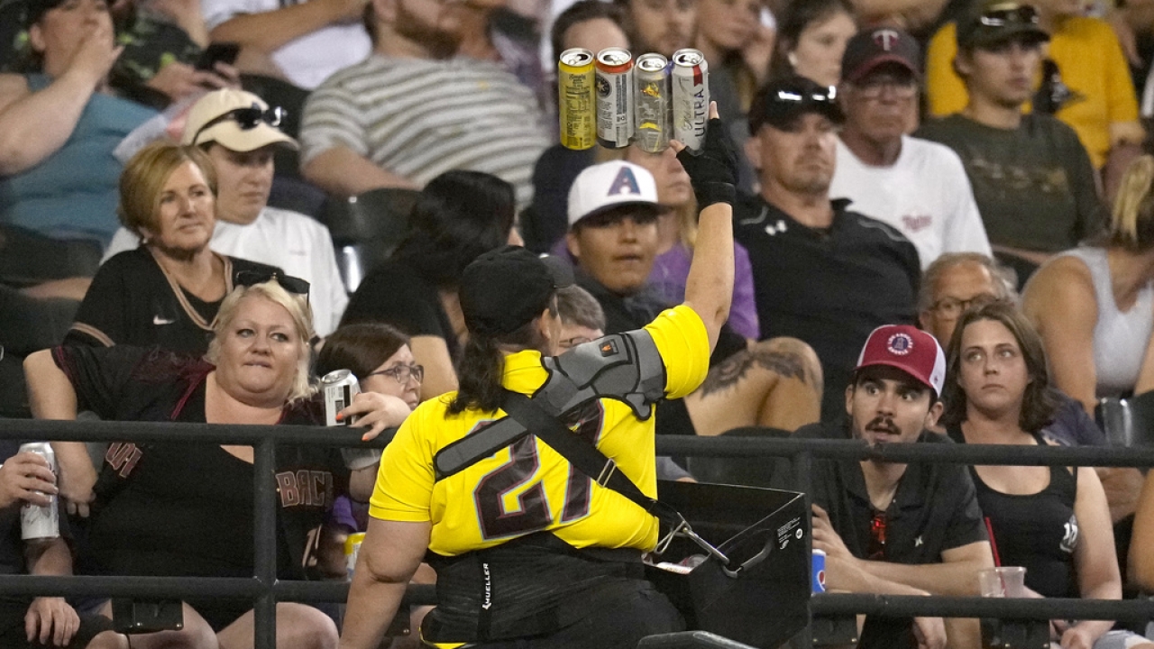 A beer vendor walks through the stands during the seventh inning of a baseball game