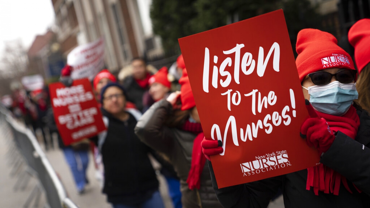 Protesters march during a nursing strike.