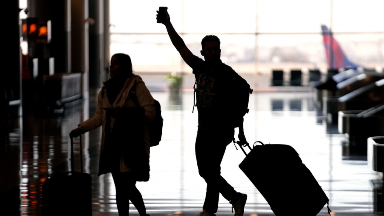 People pass through Salt Lake City International Airport on Jan. 11, 2023.