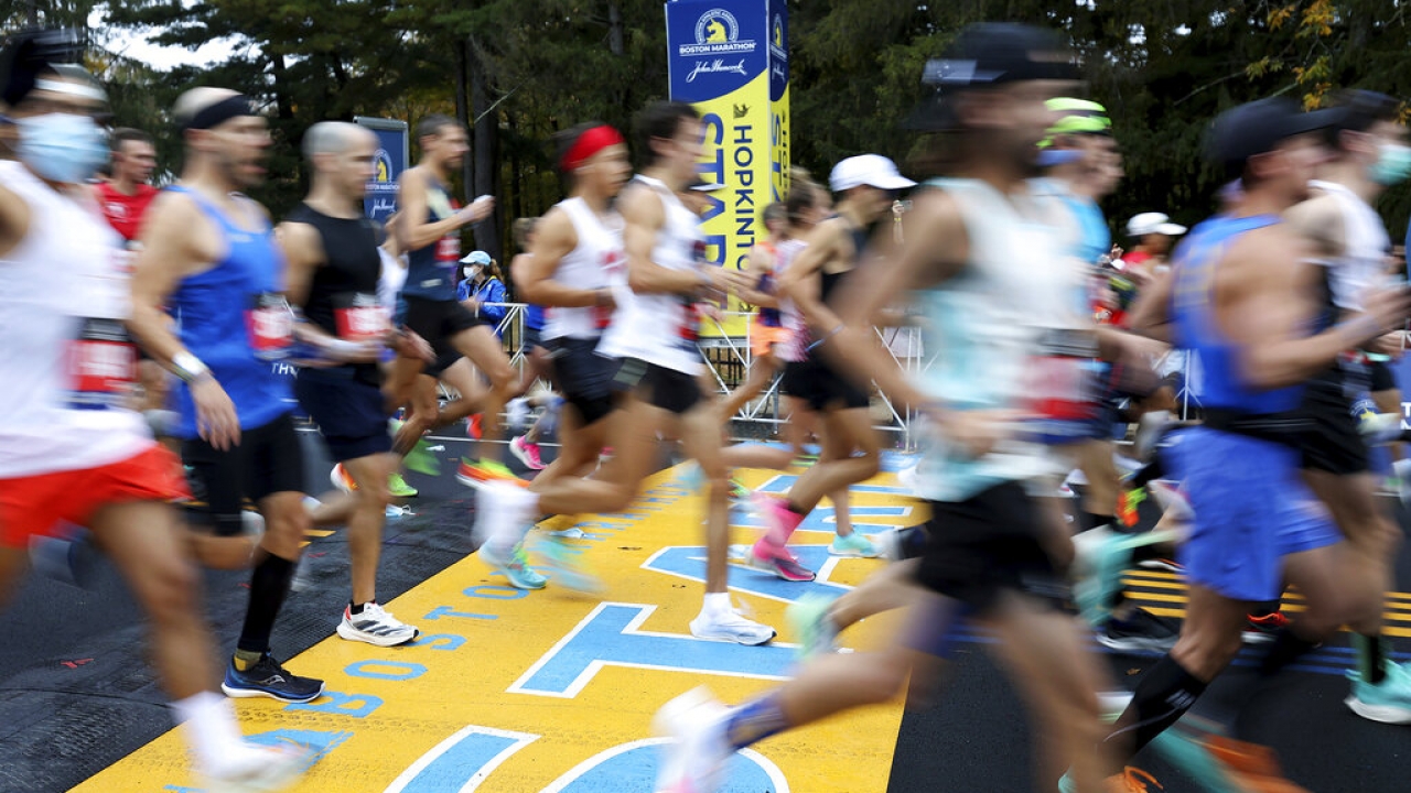 Runners cross the starting line of the 125th Boston Marathon.