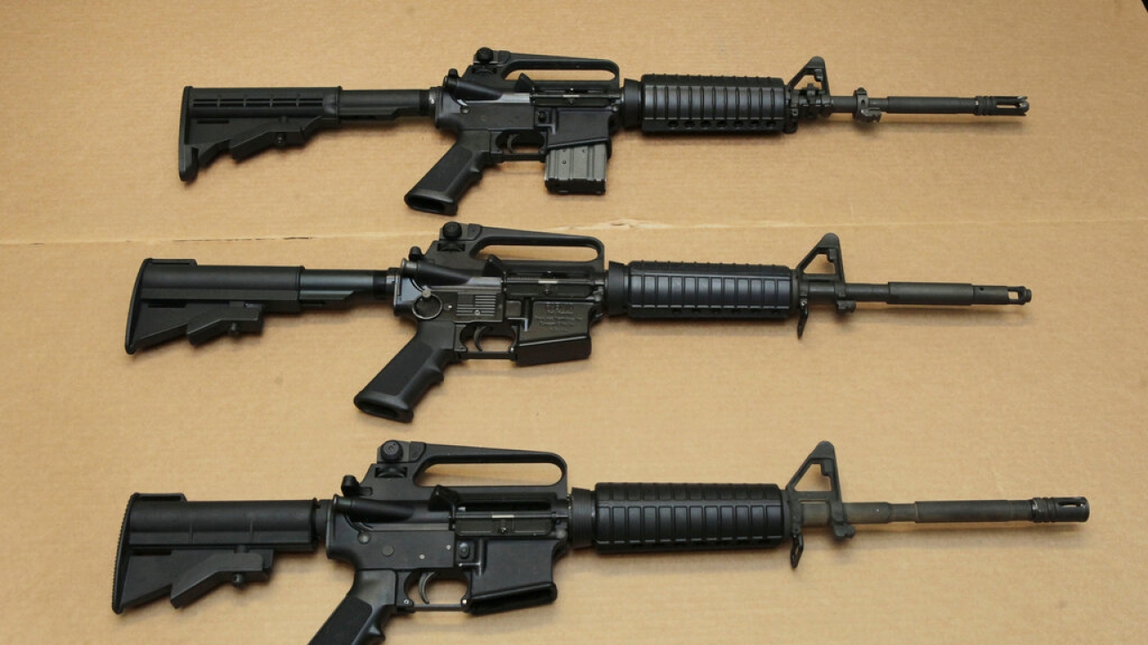 Three variations of the AR-15 assault rifle are displayed.