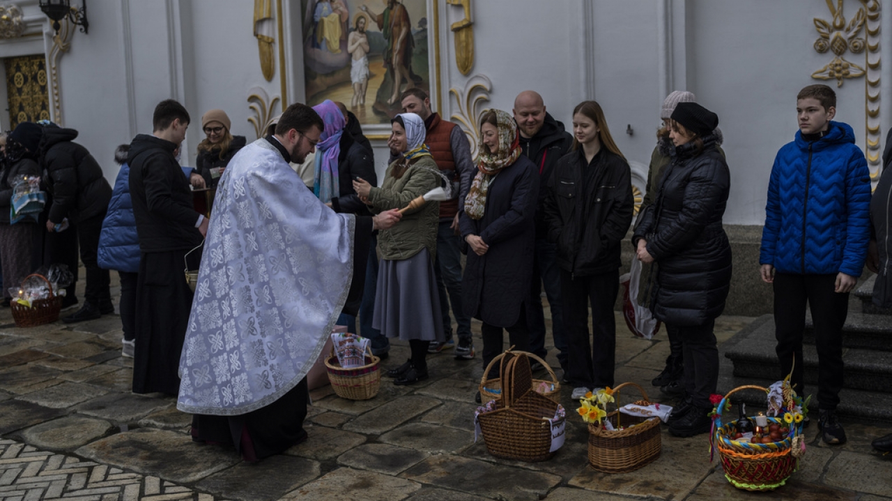 Orthodox Christian worshipers and their traditional Easter baskets are blessed during Easter Sunday in Kyiv, Ukraine.