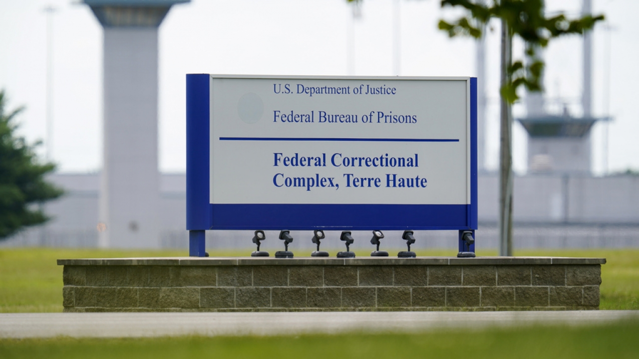 A sign is displayed at the federal prison complex in Terre Haute, Ind.