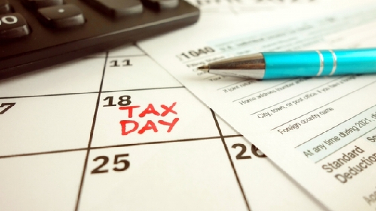 Calendar with April 18 marked for Tax Day.