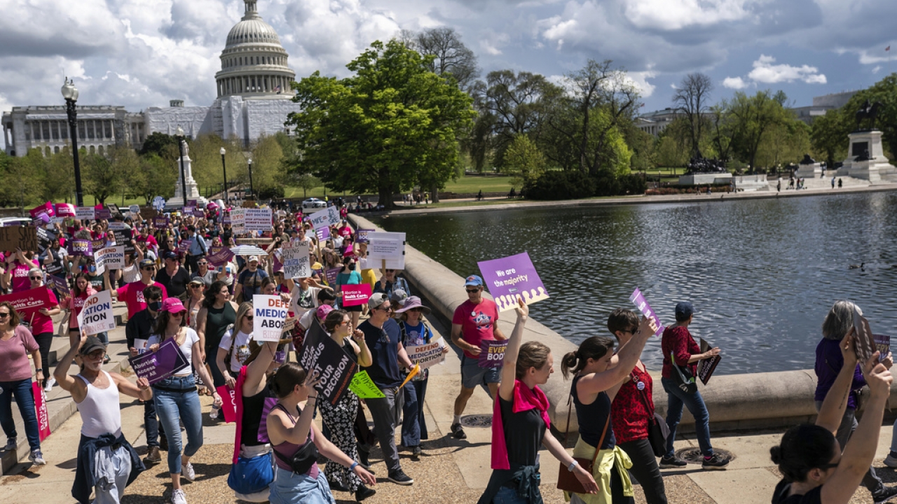 Abortion advocates march outside the U.S. Capitol.