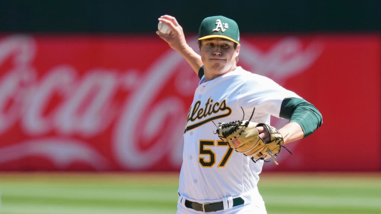 Oakland Athletics pitcher Mason Miller throws a pitch during a baseball game in Oakland, California.