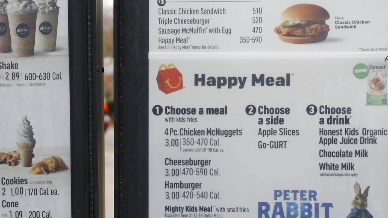 A portion of a drive thru-menu panel featuring Happy Meals is seen at a McDonald's Restaurant.