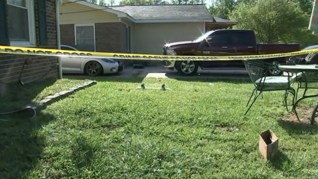Crime scene tape marks out a yard