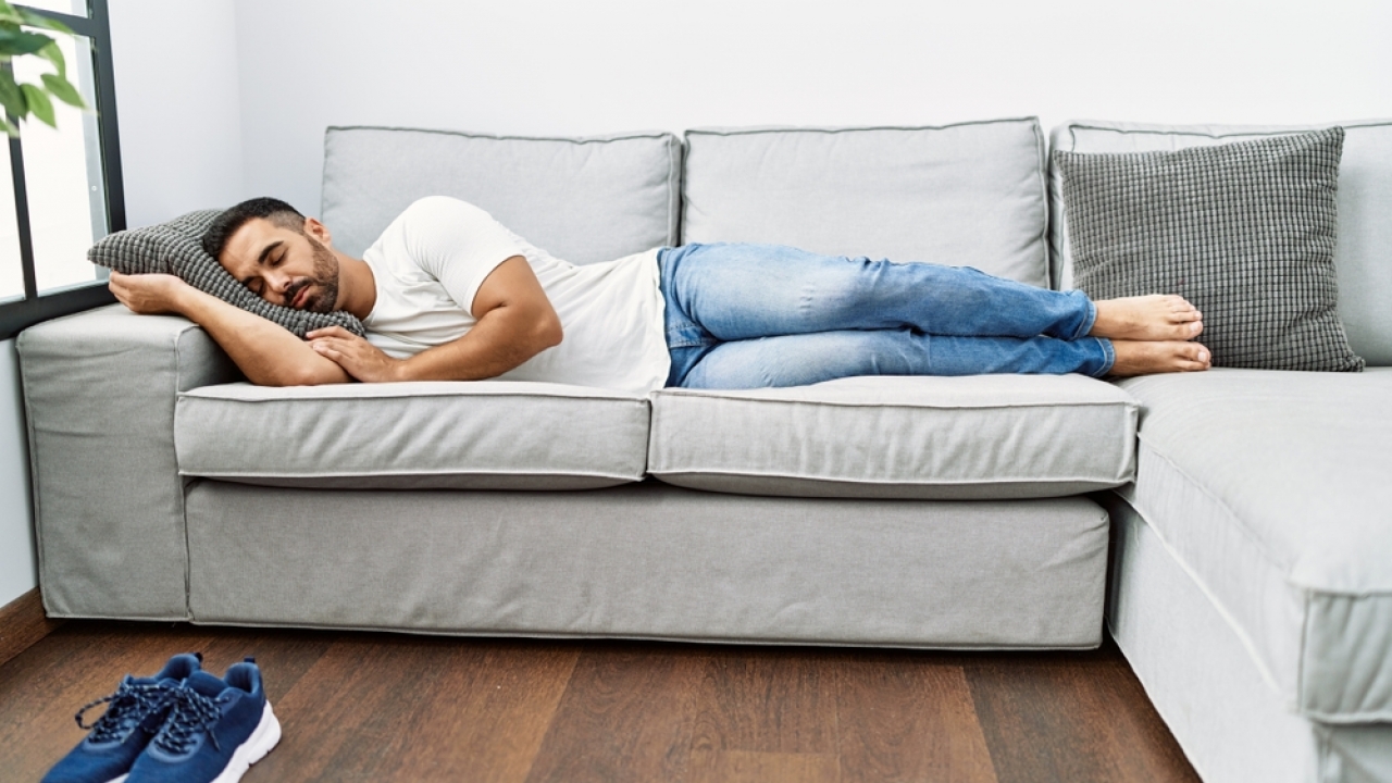 Man sleeping on a couch.