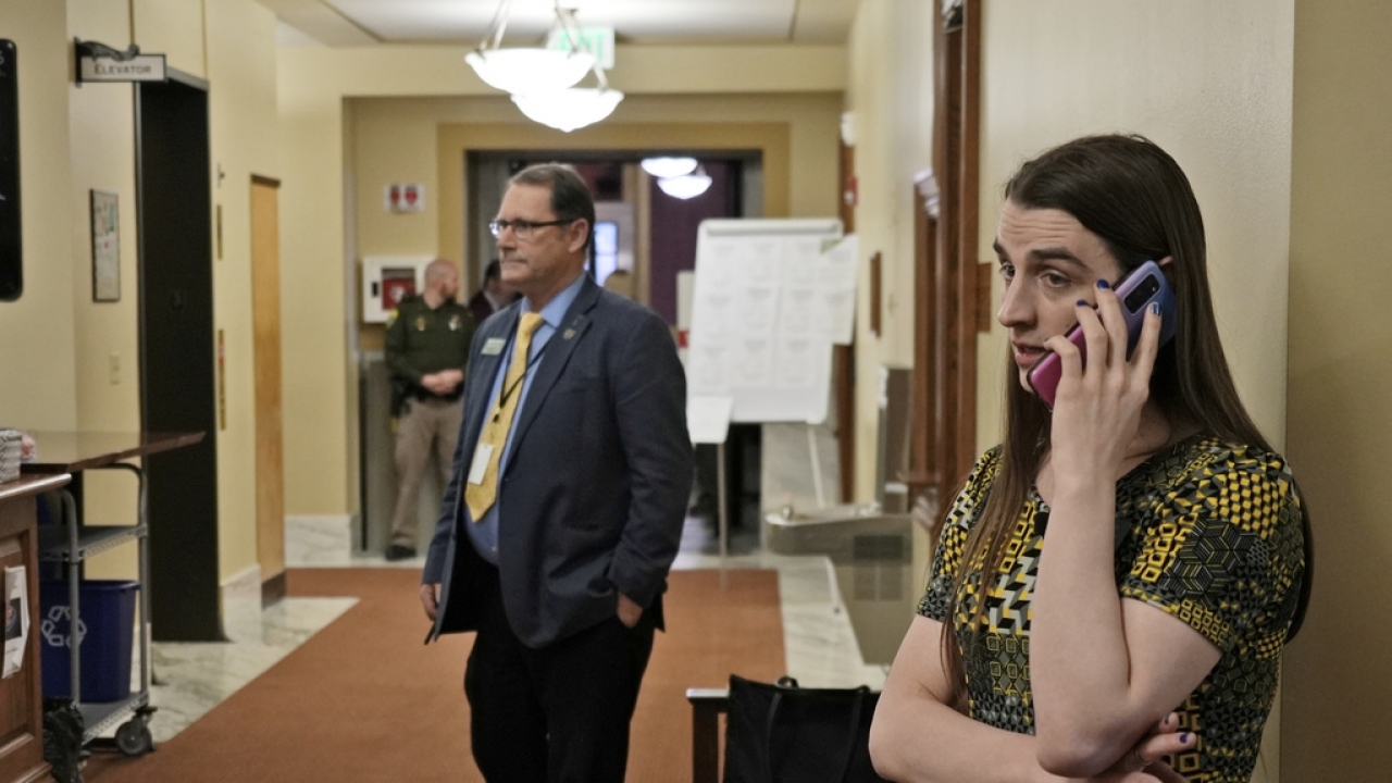 State Rep. Zooey Zephyr speaks on the phone after House Speaker Matt Regier told her she could not work from the hallway.