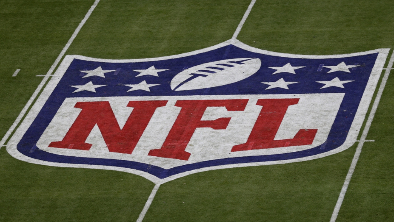 The NFL logo is seen on a field