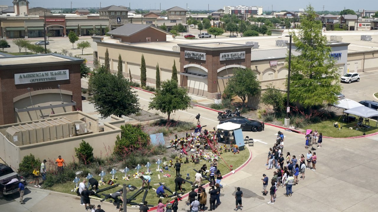 People gather around memorial for Texas mall shooting victims