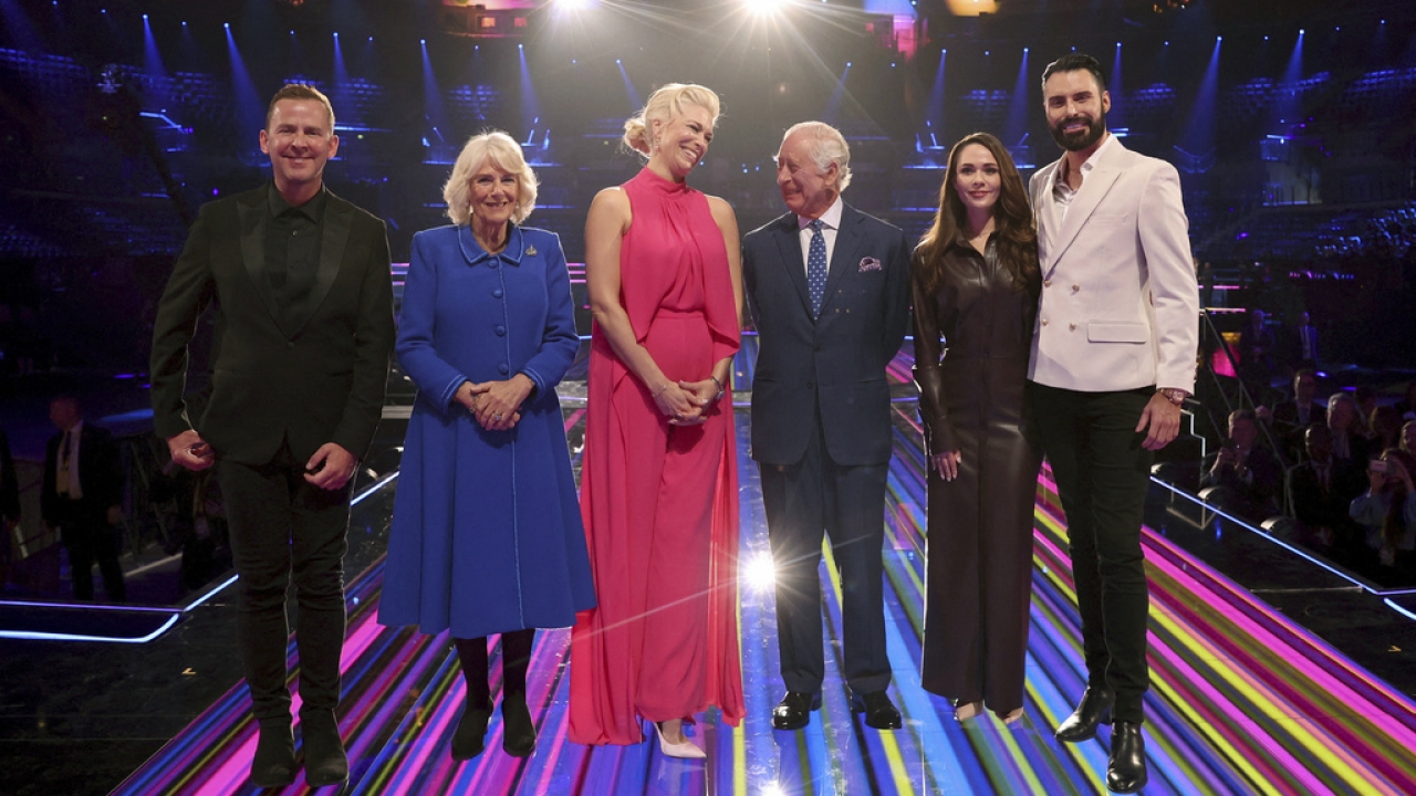 Britain's King Charles and Camilla the Queen Consort pose with Eurovision presenters.