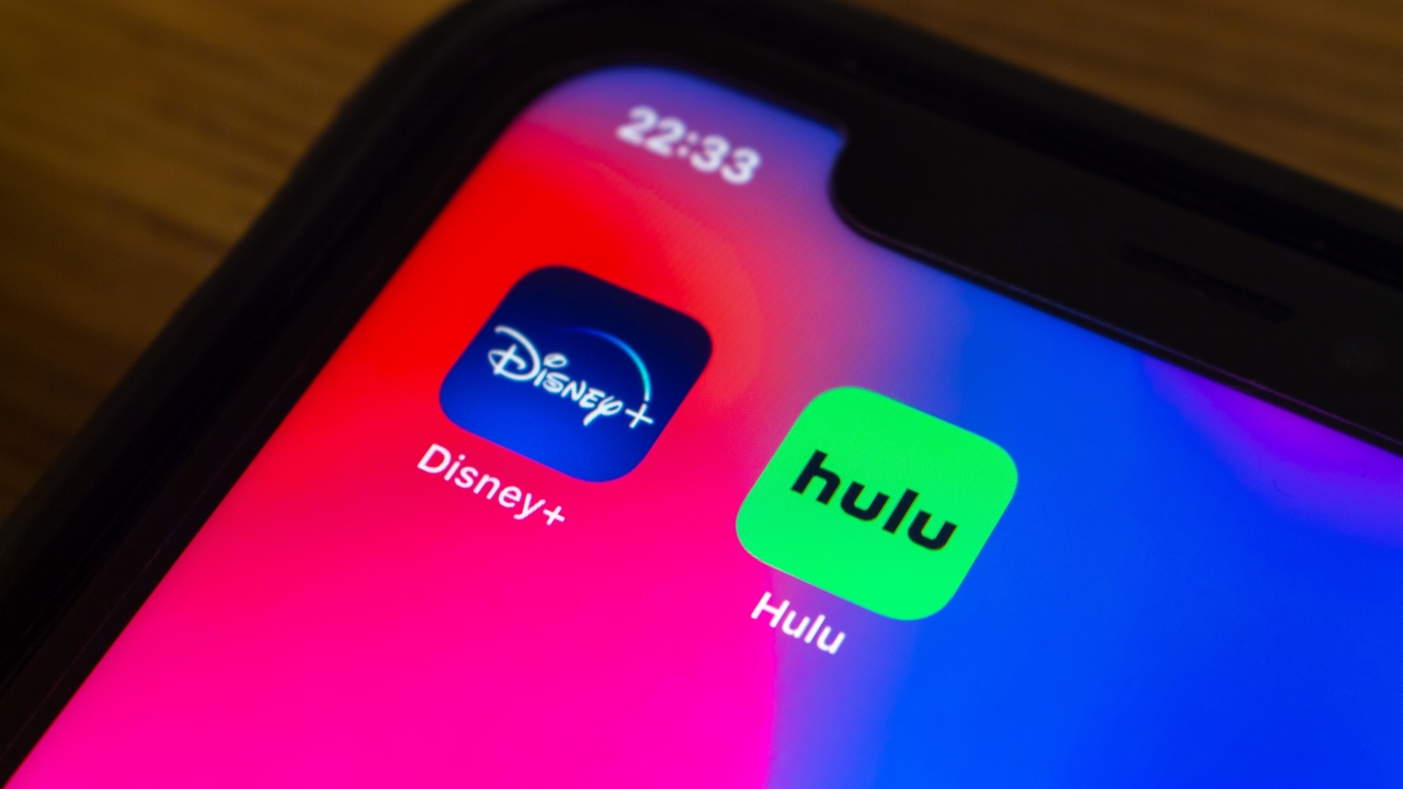 The Disney+ and Hulu apps are pictured.