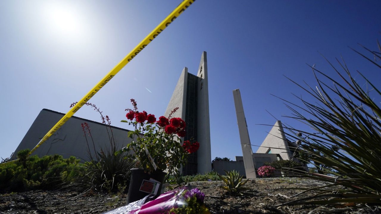 Image shows flowers near a crime scene at Geneva Presbyterian Church.