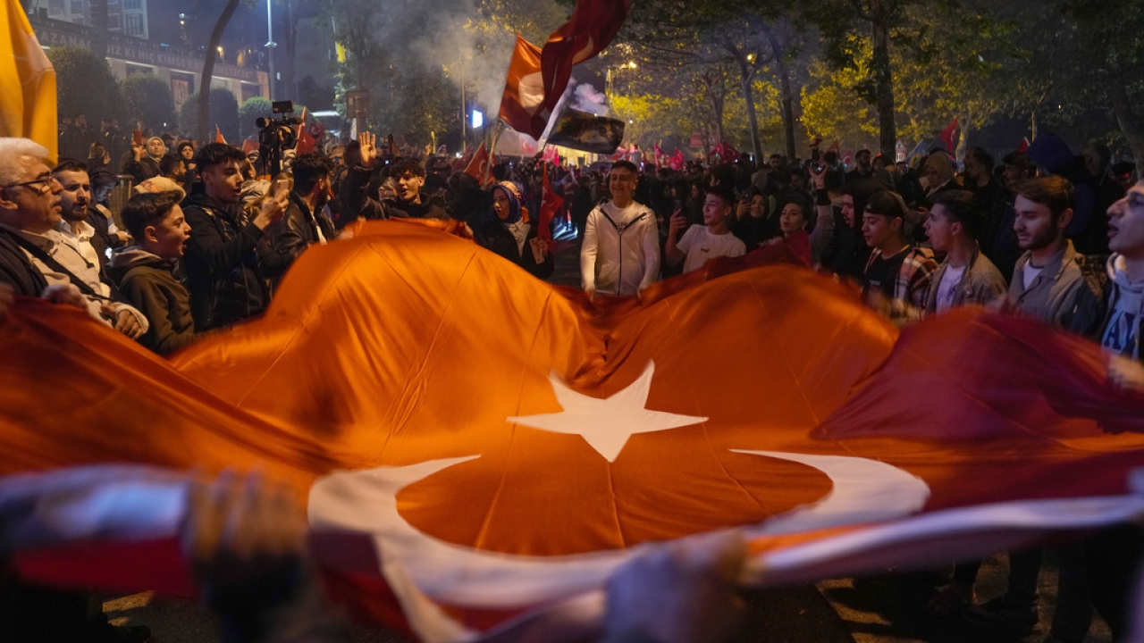 Supporters of President Recep Tayyip Erdogan celebrate outside AKP