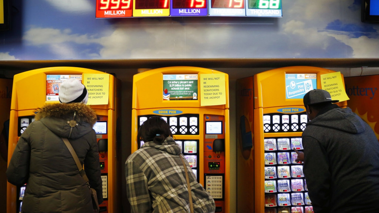 People buy lottery tickets at the Primm Valley Casino Resorts Lotto Store.