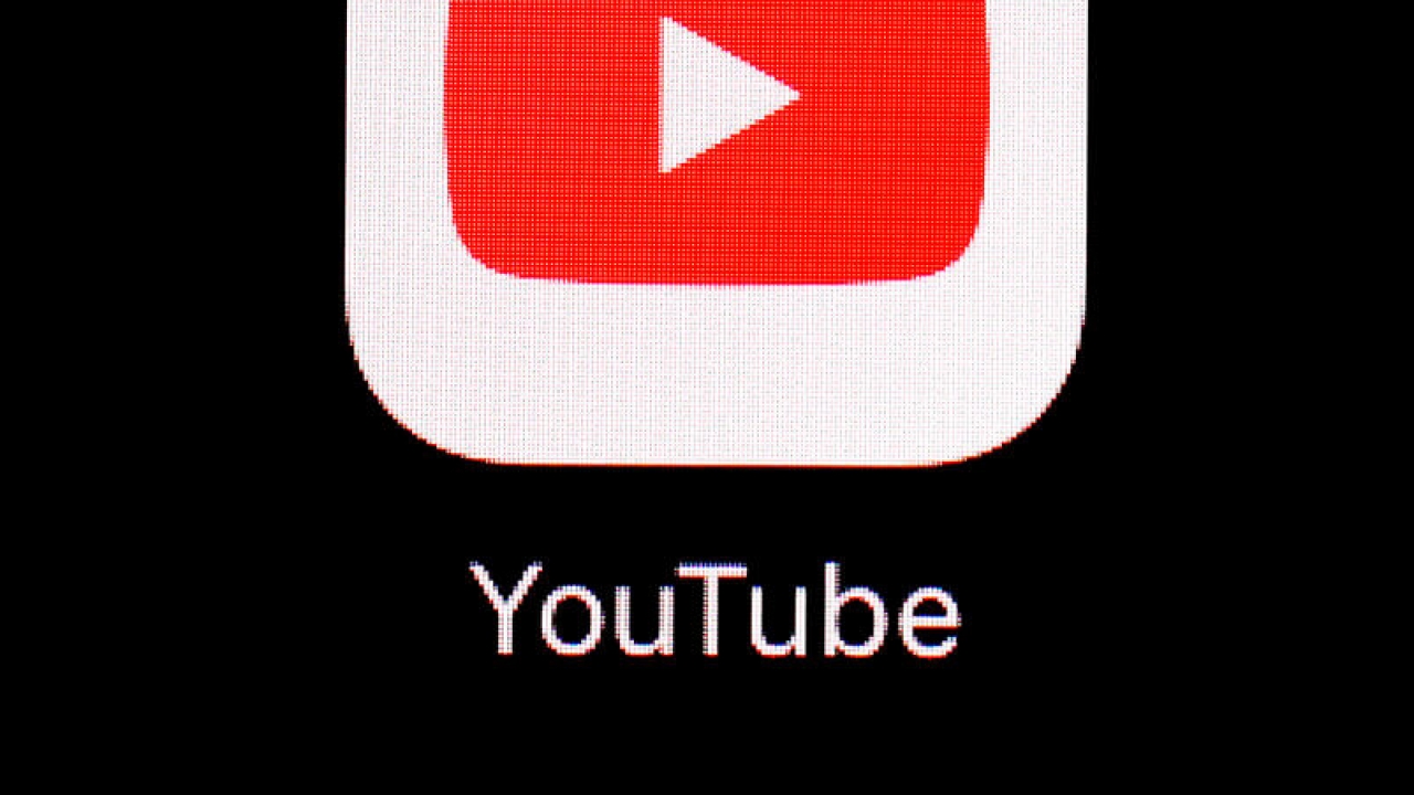 The YouTube logo is shown on a screen