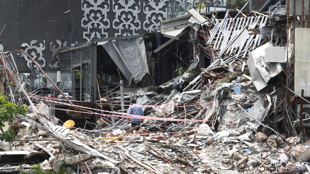 A member of the media walks through the debris of the Reina nightclub that was attacked on New Year's Day, 2017.