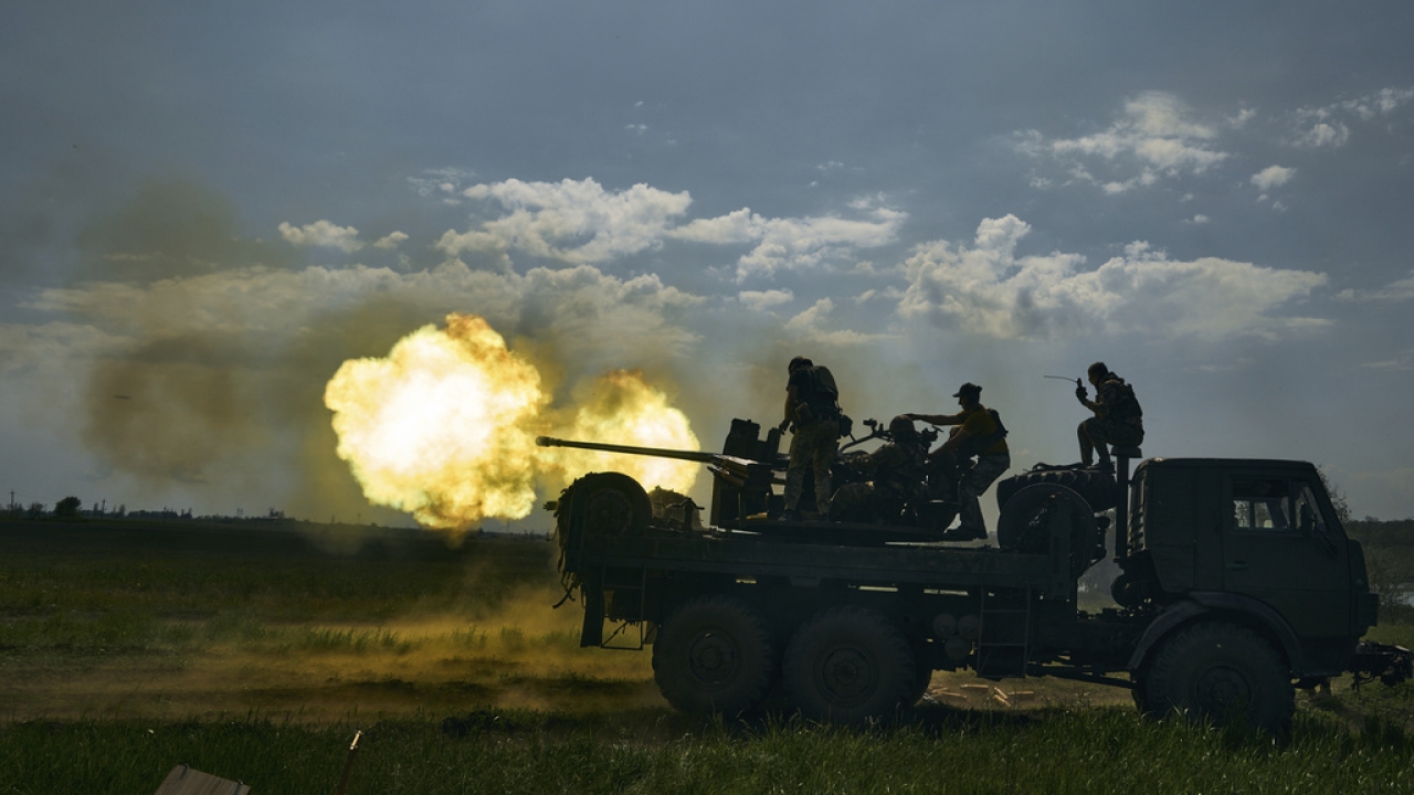 Ukrainian soldiers fire a cannon near Bakhmut.