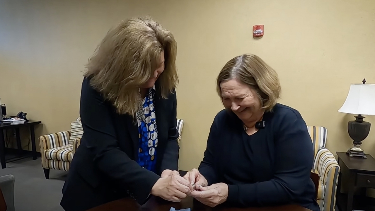 Mary Strand holds her wedding ring for the first time in 13 years.