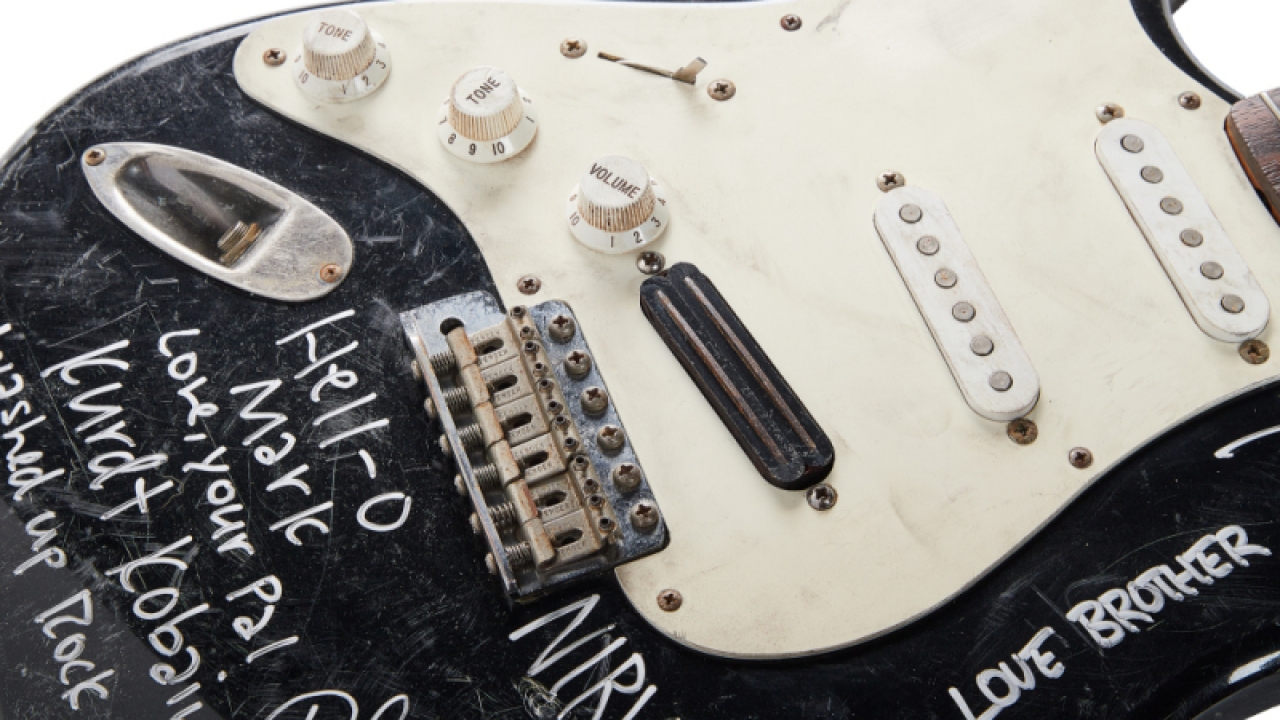 Kurt Cobain smashed and band-signed Fender Stratocaster electric guitar.