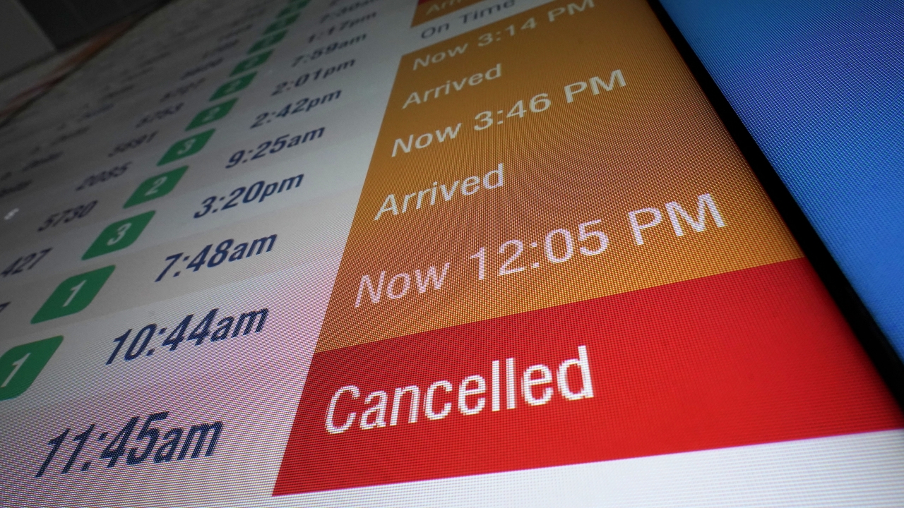 A flight board displays a cancelled flight at Logan International Airport, Wednesday, Jan. 11, 2023, in Boston.