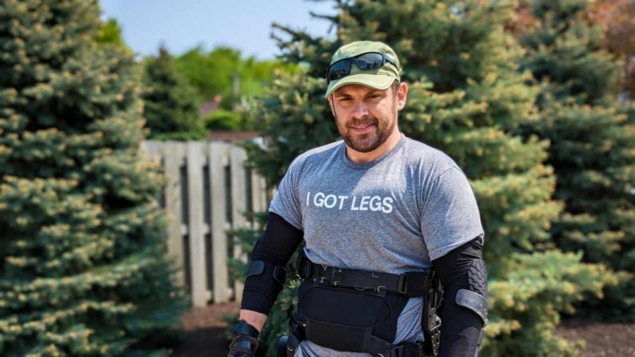 Adam Gorlitsky wearing robotic walking device.