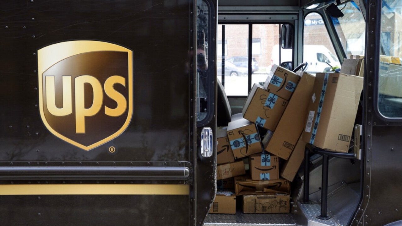 Packages await delivery inside of a UPS truck