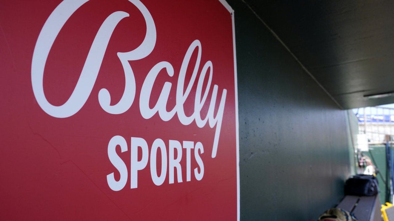 A Bally Sports logo on a dugout.
