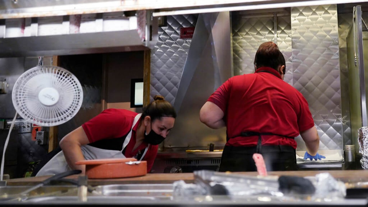 Women work in a restaurant kitchen in Chicago.