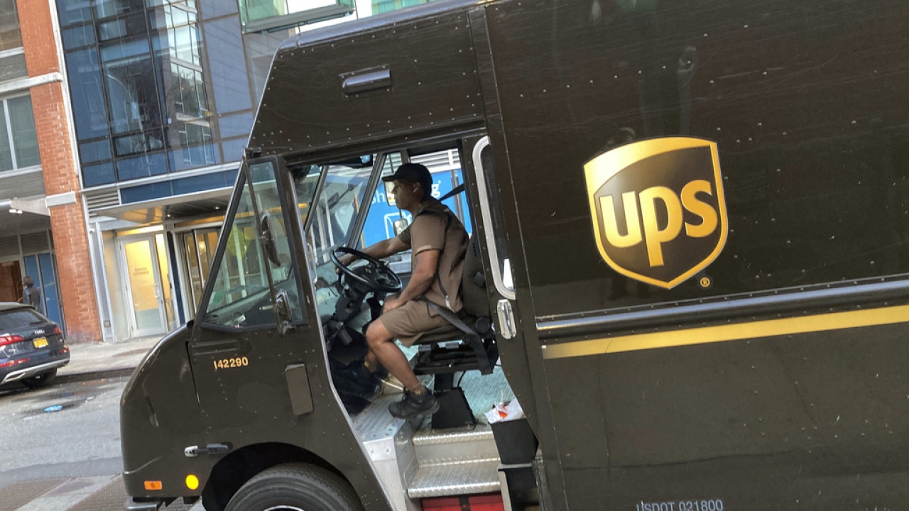 A UPS driver drives his truck in New York.